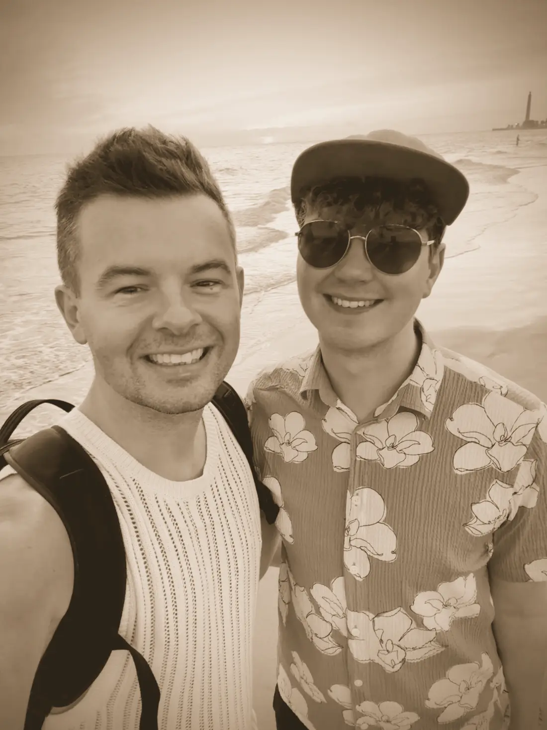 Dan and Tom on a beach at sunset